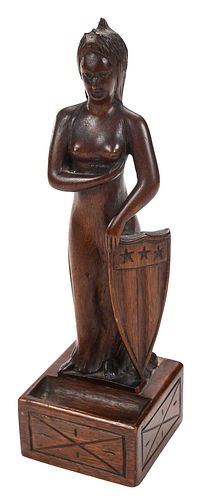 A FOLK ART CARVING OF LADY