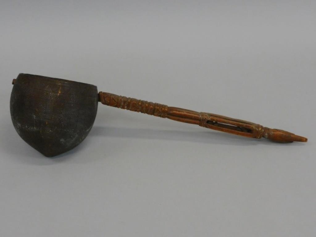 A FOLK ART COCONUT DIPPER. MID 19TH