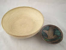 A footed patinated metal dish