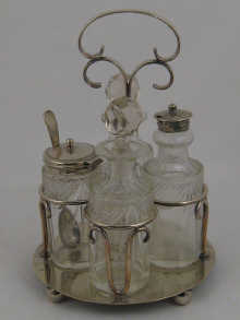A four bottle silver plated cruet.