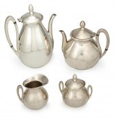 A FOUR PIECE SILVER-PLATE TEA