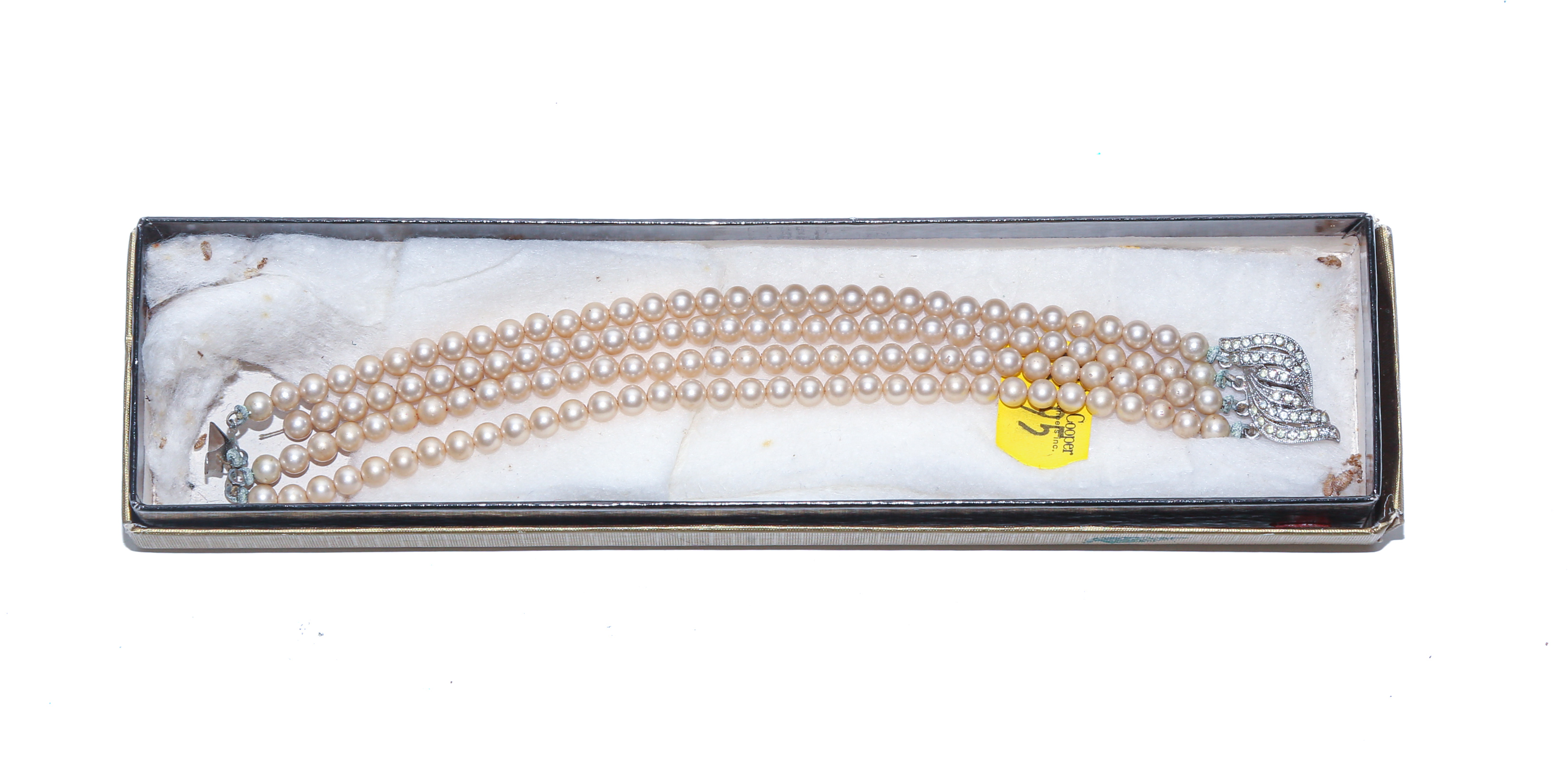 A FOUR STRAND BRACELET BY