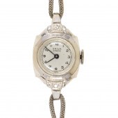 A FOURTEEN KARAT WHITE GOLD WA