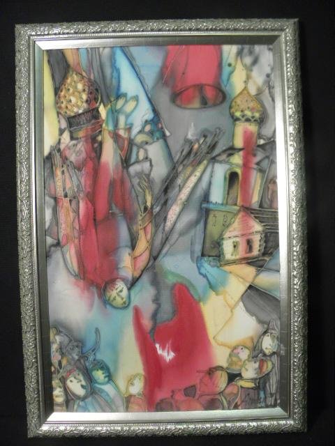 A framed abstract batik painting on