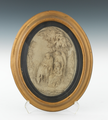 A Framed Plaster Relief Plaque of