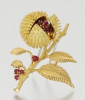 A French 18k Gold and Ruby Buc
