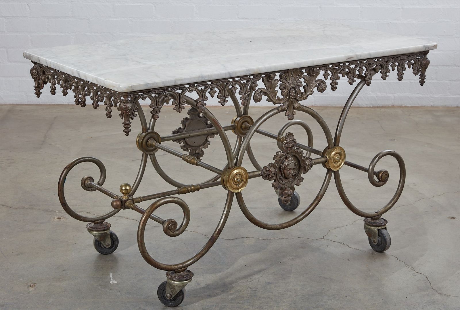 A FRENCH BRASS MOUNTED WROUGHT IRON