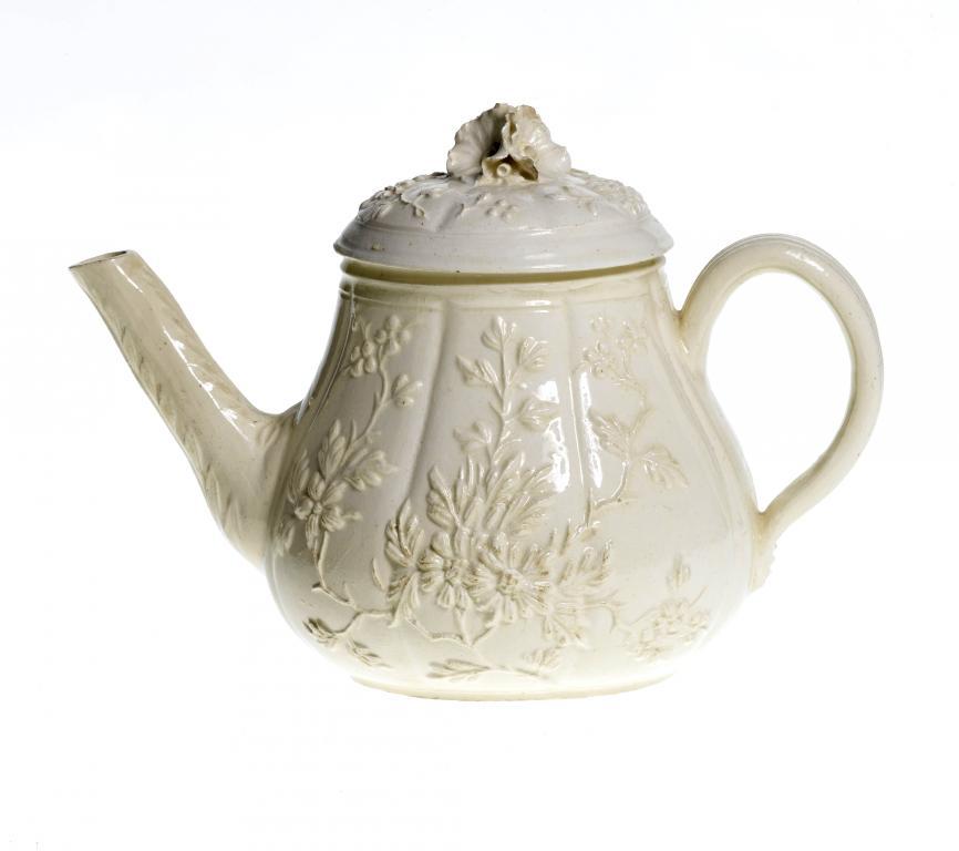 A FRENCH CREAMWARE TEAPOT AND