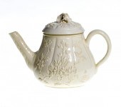A FRENCH CREAMWARE TEAPOT AND