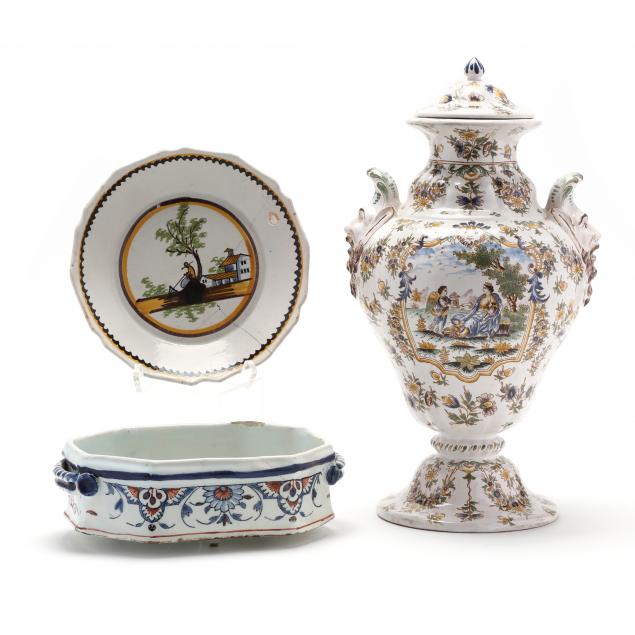 A FRENCH FAIENCE COVERED POLYCHROME