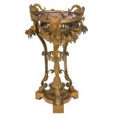 A FRENCH GILT BRONZE AND ROUGE