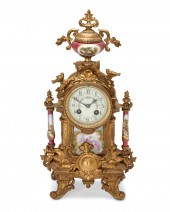 A FRENCH GILT-BRONZE AND PORCE