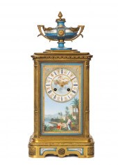 A FRENCH GILT-BRONZE AND PORCE