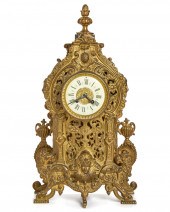 A FRENCH GILT-BRONZE MANTLE CL