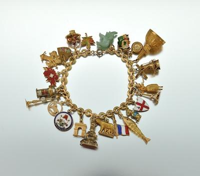 A French Gold Bracelet With Charms,