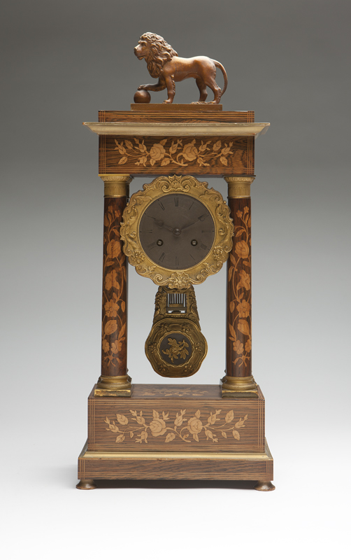 A French marquetry portico mantle