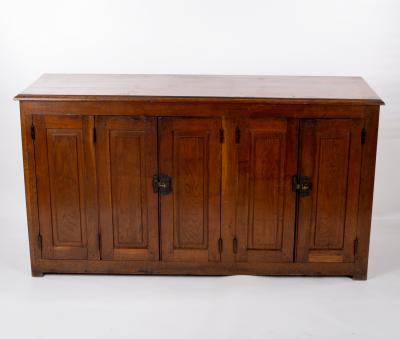 A French oak cupboard enclosed by