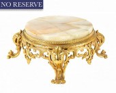 A FRENCH ONYX ORMOLU TABLE PLA