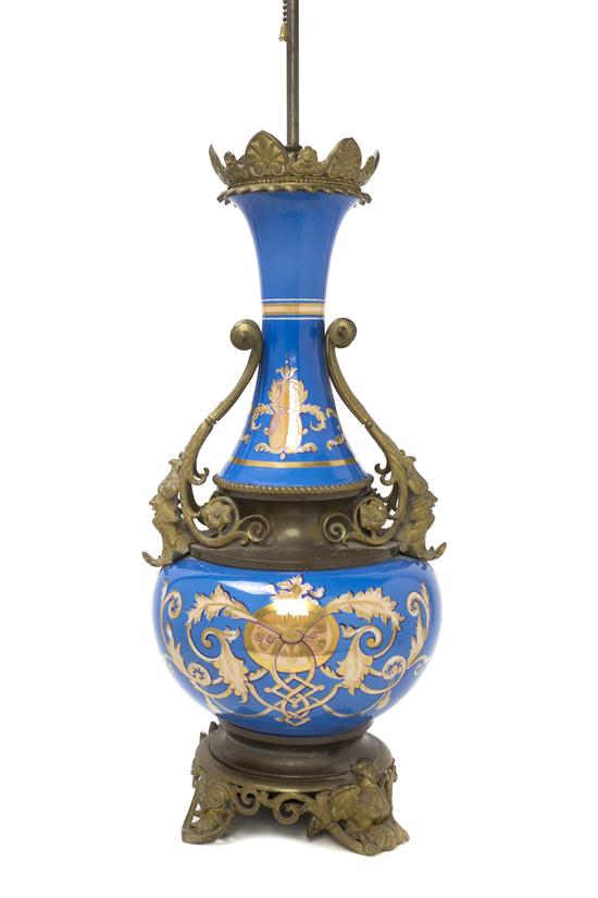A French Porcelain and Gilt Metal