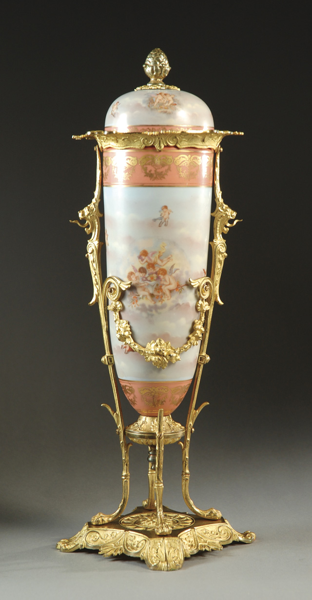 A FRENCH PORCELAIN COVERED URN (the