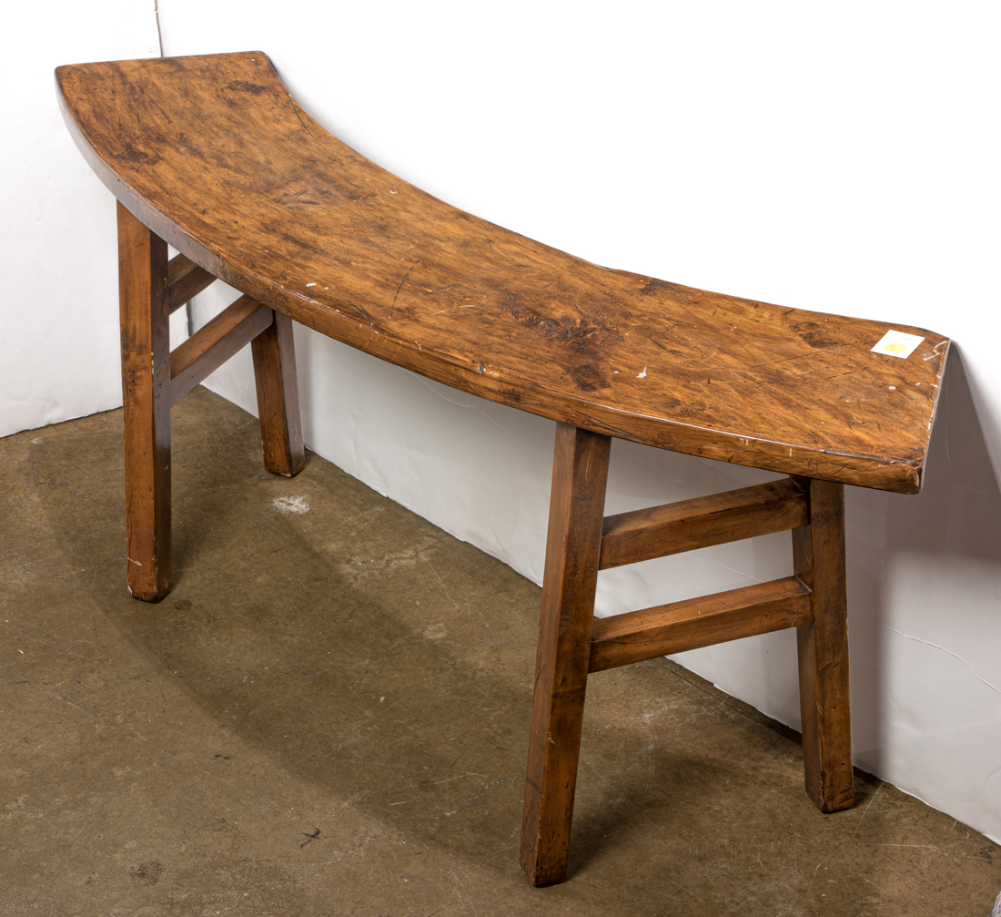 A FRENCH PRIMITIVE CURVED BENCH A