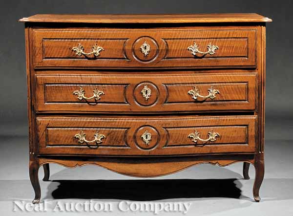 A French Provincial Carved Walnut
