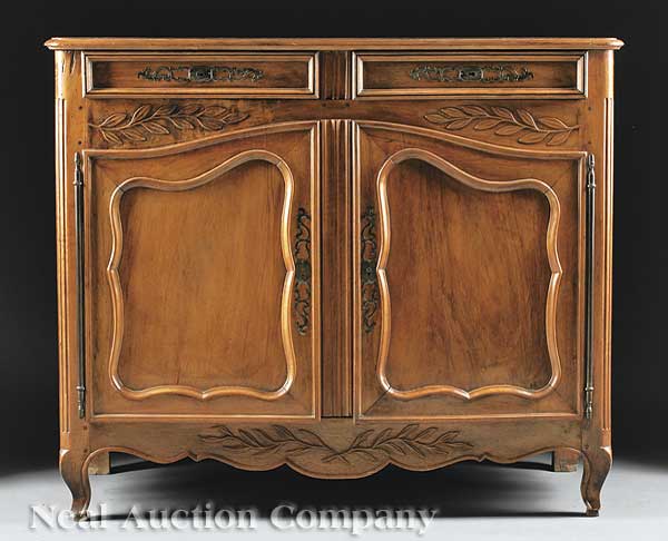 A French Provincial Carved Walnut