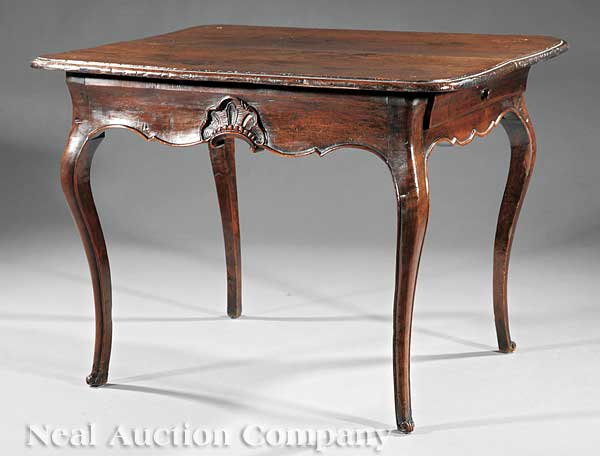 A French Provincial Carved Walnut