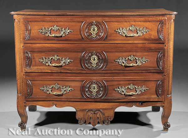 A French Provincial Carved Walnut