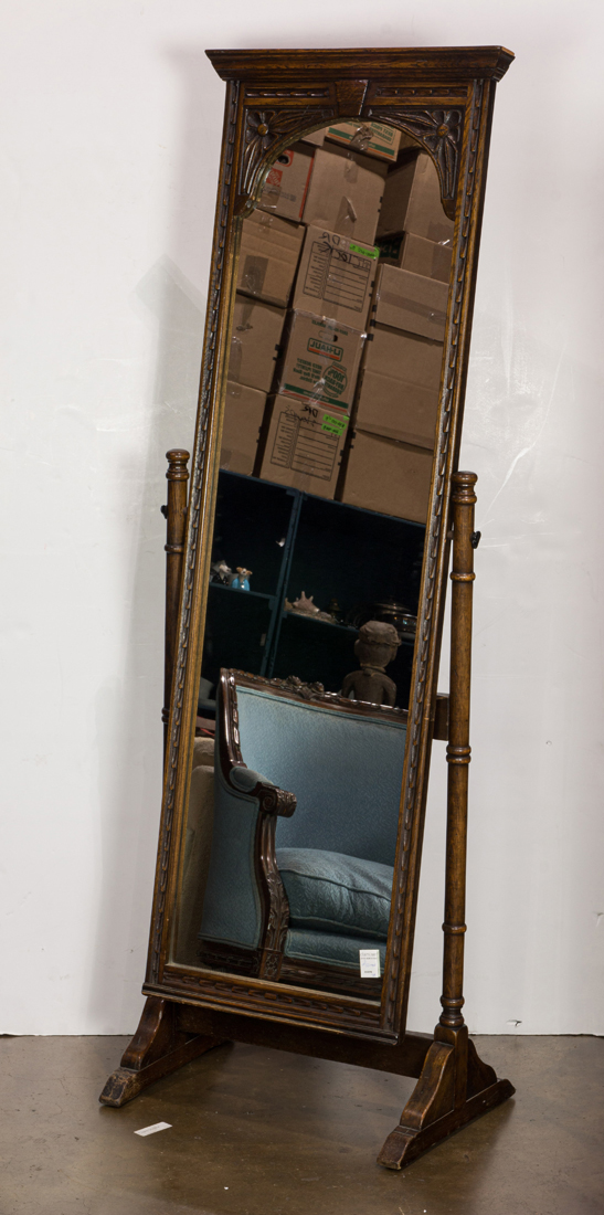 A FRENCH PROVINCIAL EBONIZED OAK