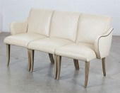 A FRENCH UPHOLSTERED THREE SEA