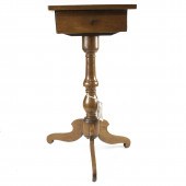 A FRENCH WALNUT CANDLESTAND A
