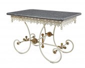 A FRENCH WROUGHT IRON PASTRY T