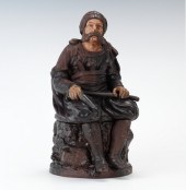 A Full Figural Tobacco Jar of