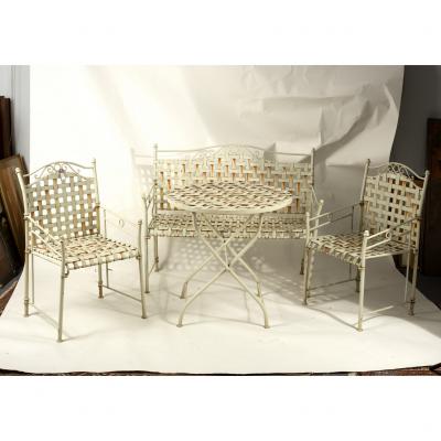 A garden bench, two chairs and a