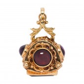 A GARNET AND 18K GOLD PENDANT