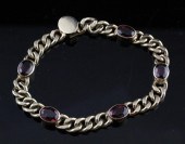 A garnet set gold curblink bra