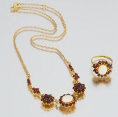 A Garnet White Opal and Vermei
