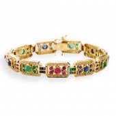 A GEMSTONE AND EIGHTEEN KARAT