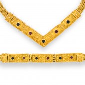 A GEMSTONE AND EIGHTEEN KARAT