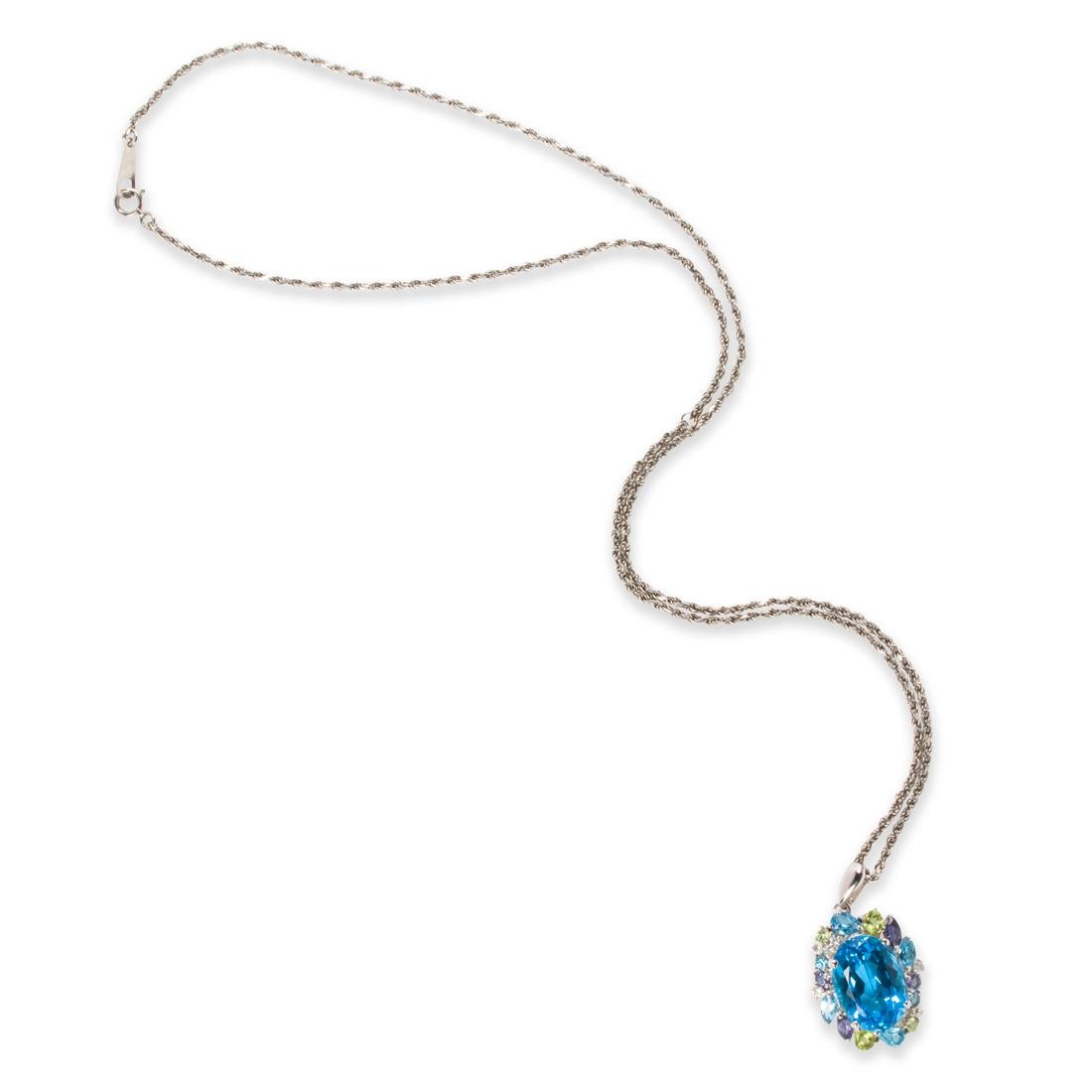A GEMSTONE AND PLATINUM PENDANT
