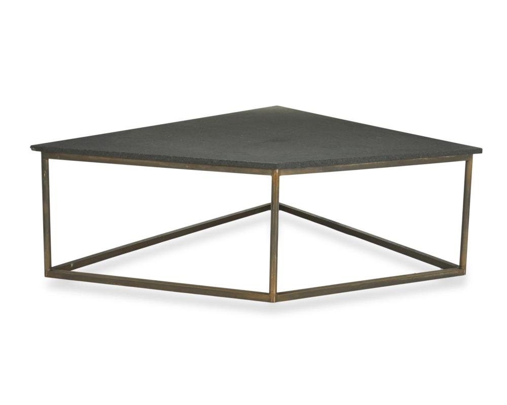 A GEOMETRIC STONE COFFEE TABLE,