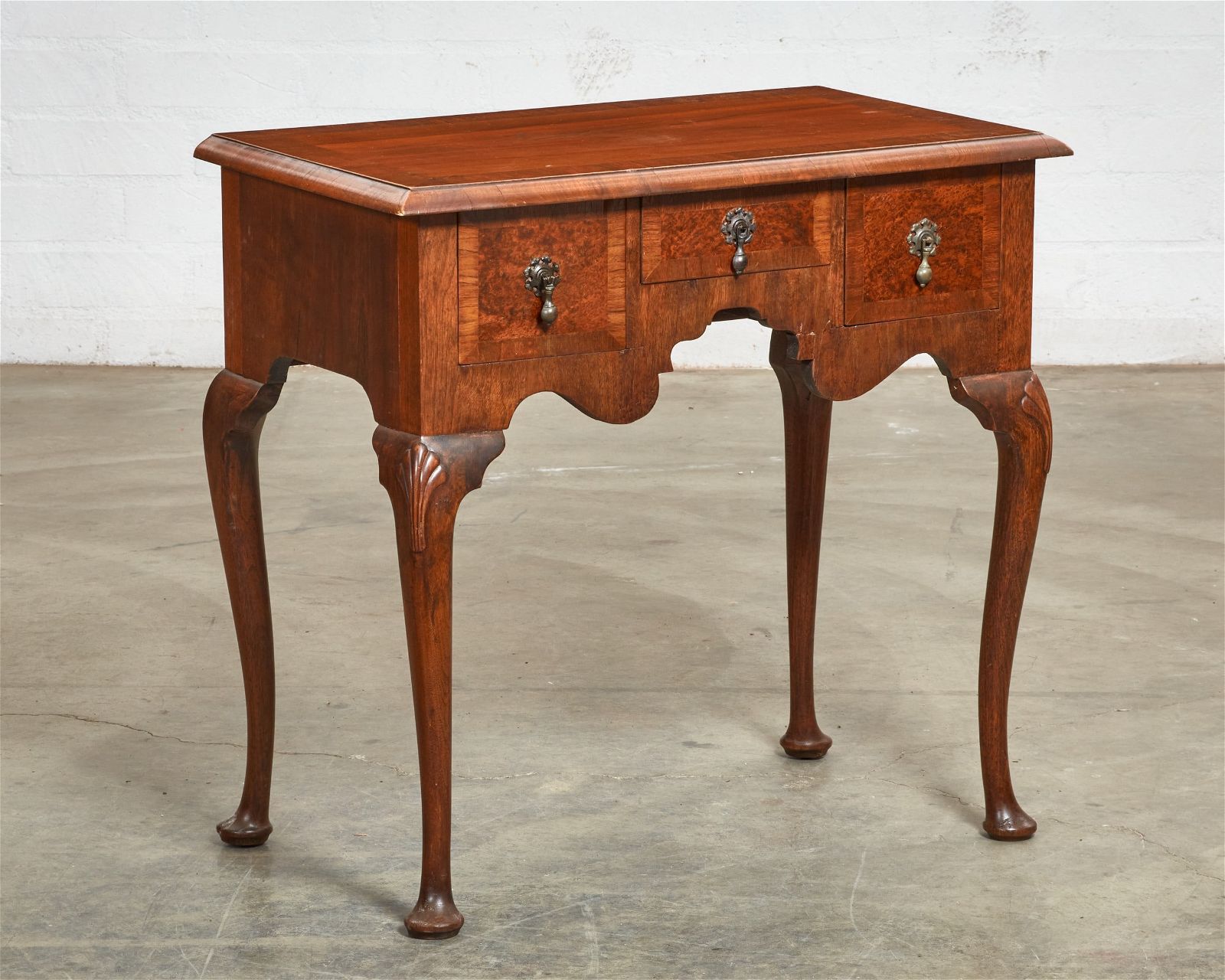 A GEORGE I STYLE CROSSBANDED WALNUT