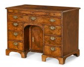 A GEORGE I WALNUT KNEEHOLE DES