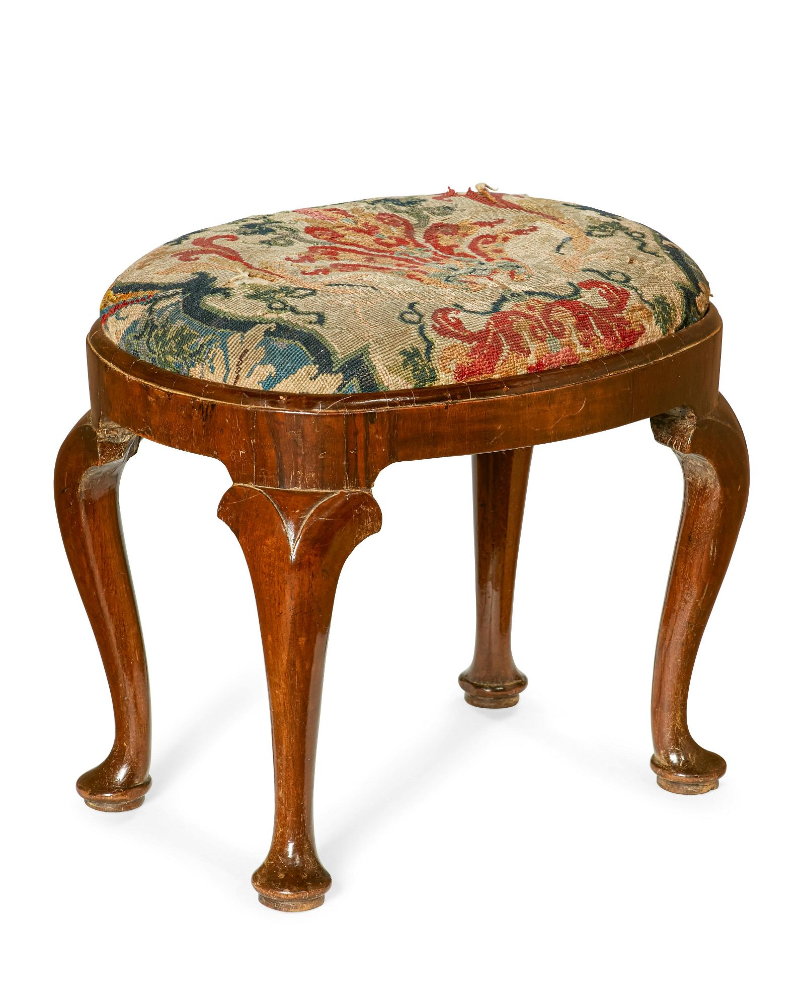 A GEORGE I WALNUT OVAL STOOLA