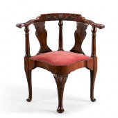 A GEORGE II CARVED MAHOGANY CO