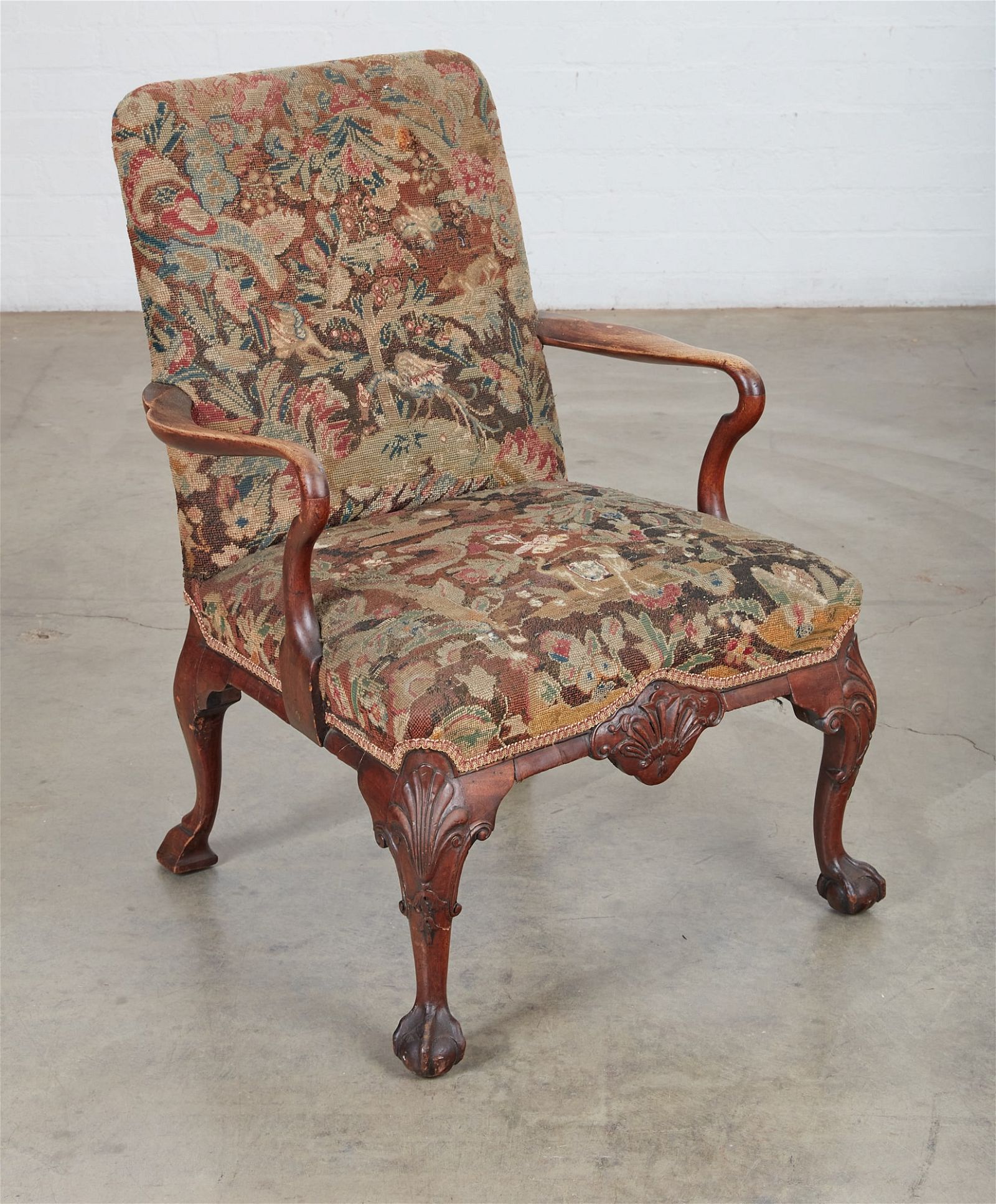A GEORGE II CARVED WALNUT OPEN