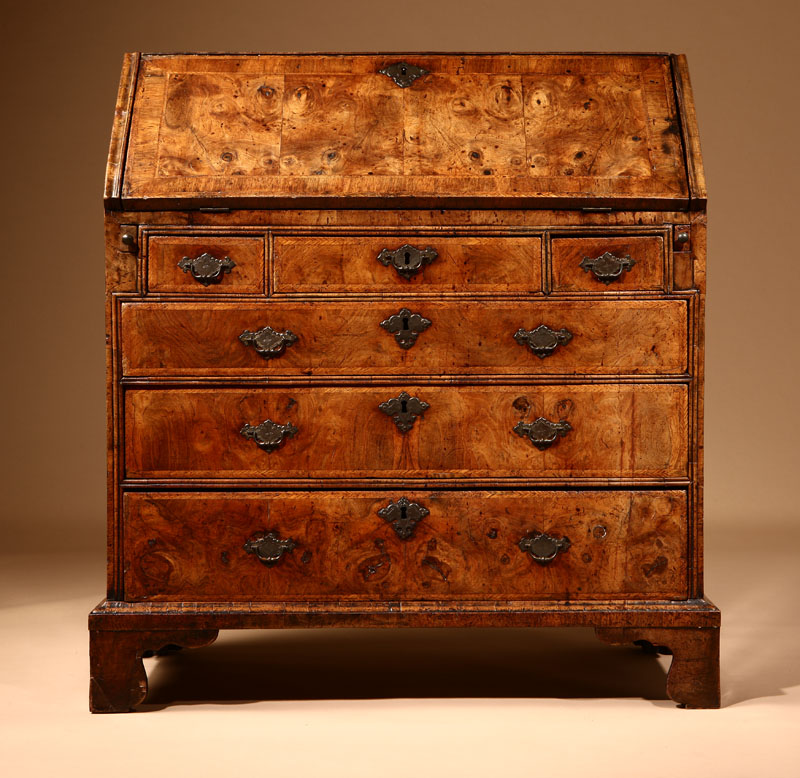 A George II feather-banded walnut