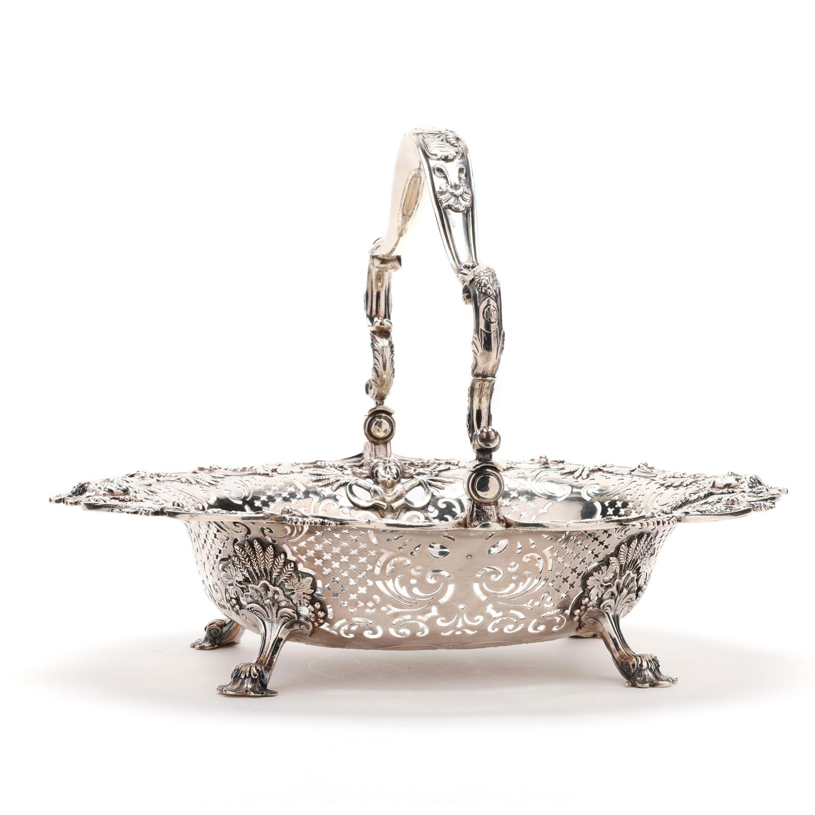 A GEORGE II SILVER CAKE BASKET,