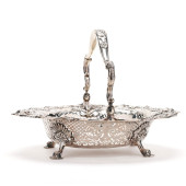 A GEORGE II SILVER CAKE BASKET